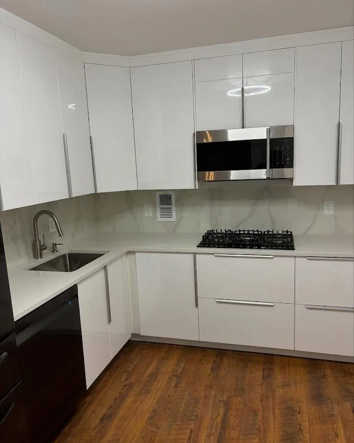 Restored kitchen with white cabinets after water damage in Independence